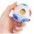 Kéz tart egy többszínű antistressz labdát, Interaktív játék antistressz labda, többszínű, + 3 év