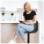 Woman using a tablet while sitting on Sofotel Nerra black bar stool