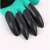 Close-up of the black claws on the gardening gloves
