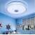 Bluetooth ceiling light with RGB color and speaker, controlled by remote and smartphone, installed in a bedroom