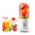White portable blender with fruits inside, perfect for smoothies and juices on the go
