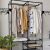 Ruhhy double clothing rack with clothes and plant