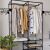 Ruhhy double clothing rack with clothes and plant