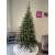 Sersimo Deluxe Nature 3D Műfenyő Karácsonyfa 230cm egy díszített nappaliban
