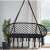 Black double hammock swing chair with cushions, Pepita, hanging in a room
