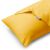 Close-up of DecoKing AMBER yellow jersey pillow cover with Restilo tag