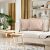 AmeliaHome Ophelia powder pink cushion covers on a sofa in living room setting