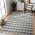 Hakano Wink Rhombus gray rug in living room setting, 120x170 cm