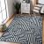 Hakano Wink Maze Rug in Living Room Setting, Blue and Cream Geometric Rug