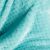 Close-up of the textured turquoise fabric of a SHLEEPY blanket