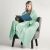 Woman wrapped in DecoKing MIC mint green blanket reading a book