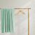 DecoKing MIC mint green blanket draped over a wooden rack