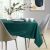 AmeliaHome Gaia glass green embossed tablecloth in a modern dining room