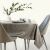 AmeliaHome Gaia cappuccino tablecloth on a dining table with modern decor.