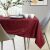 AmeliaHome Gaia claret embossed tablecloth on dining table with modern decor.