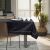 AmeliaHome Gaia black embossed tablecloth on dining table in a room setting.