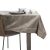 AmeliaHome Gaia cappuccino embossed tablecloth on table with tableware.