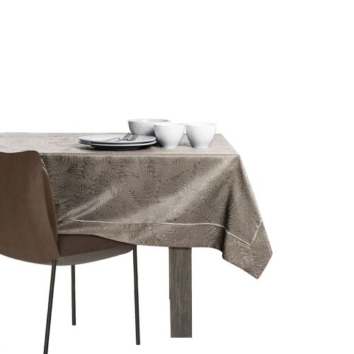 AmeliaHome Gaia cappuccino embossed tablecloth on a set table against white background.