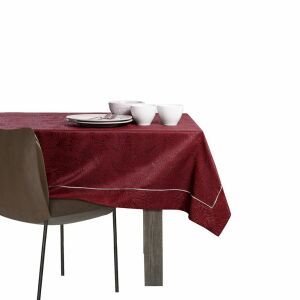 AmeliaHome Gaia burgundy embossed tablecloth 140x220 cm on a table setting with dishes. - Interior design