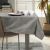 Dining room setting with AmeliaHome Gaia brown embossed tablecloth
