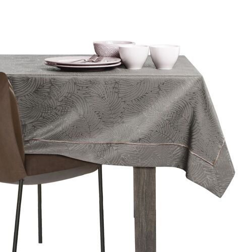AmeliaHome Gaia brown embossed tablecloth on a dining table with tableware.