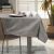 AmeliaHome Gaia brown embossed tablecloth in a dining room setting with natural light.