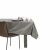 AmeliaHome Gaia brown embossed tablecloth on a table with tableware.