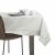 AmeliaHome Gaia cream embossed tablecloth on table with tableware