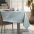 AmeliaHome Gaia mint green embossed tablecloth on dining table with plant