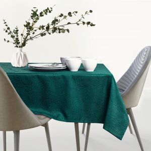 AmeliaHome Gaia tablecloth in bottle green with embossed leaf pattern, set on a table with chairs - AmeliaHome