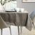 AmeliaHome Gaia cappuccino tablecloth on a table setting in a bright room