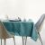 AmeliaHome Gaia teal embossed tablecloth on table setting.