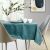 AmeliaHome Gaia teal embossed tablecloth on dining table with decor
