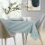 AmeliaHome Gaia mint green embossed tablecloth in a modern dining room setting