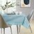 AmeliaHome Gaia blue embossed tablecloth on a set table with modern decor.