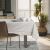 AmeliaHome Vesta cream embossed tablecloth on table in a stylish dining room