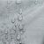 Water droplets on AmeliaHome Vesta grey embossed tablecloth
