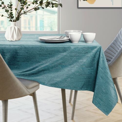 AmeliaHome Vesta teal embossed tablecloth on a set table.