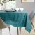 Close-up of AmeliaHome Vesta teal embossed tablecloth on a table setting