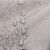Close-up of AmeliaHome Vesta powder rose embossed tablecloth with water droplets, spill proof