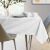 AmeliaHome Vesta white embossed oval tablecloth on table