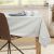 DecoKing Maya beige classic printed tablecloth on a table in a dining room setting