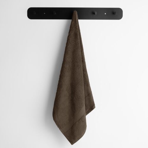 Brown DecoKing BAMBY towel hanging on a hook