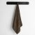 DecoKing Bamby brown towel 70x140 cm hanging on a rack
