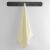 DecoKing Bamby cream towel 50x100 cm hanging on a rack