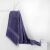 DecoKing Bamby purple towel 50x100 cm draped on a white surface