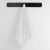 White Marina towel by DecoKing hanging on a black rack