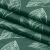 Close-up of AmeliaHome Calm bottle green blackout curtain fabric with leaf pattern