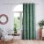 AmeliaHome Calm bottle green blackout curtain hanging in a living room setting