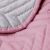 Close-up of AmeliaHome SOFTA pink and grey quilted bedspread texture